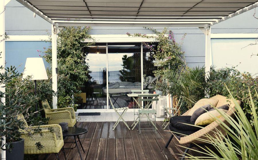 Covered outdoor terrace with timber details and garden views